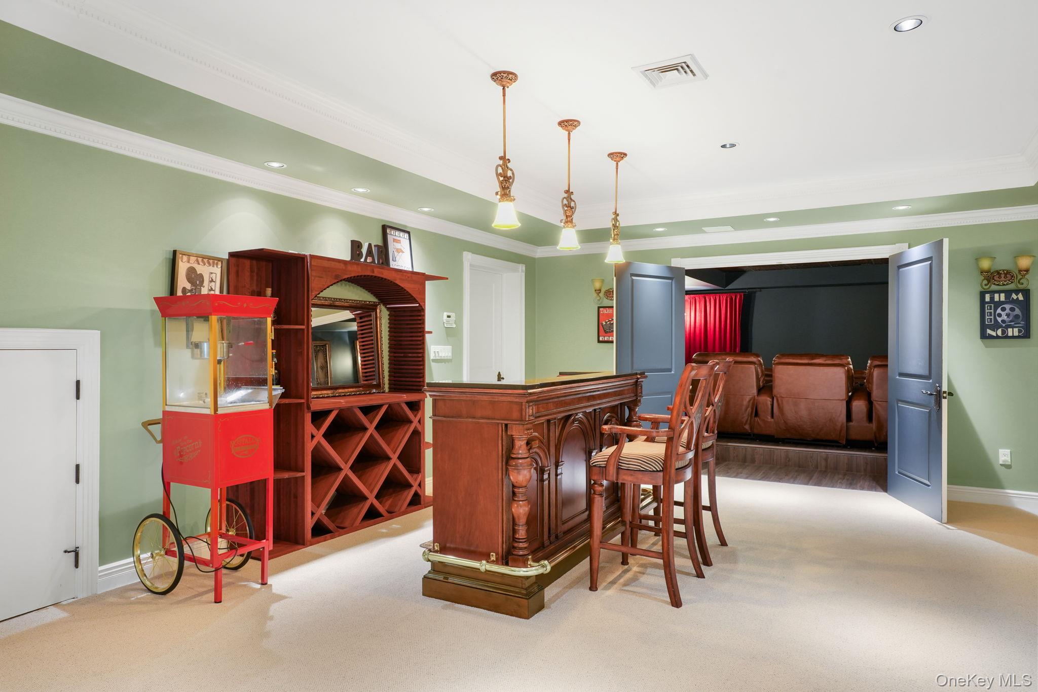 4 Hageman Court Katonah, NY 10536 - Photo 34 of 47 a living room with furniture and a chandelier