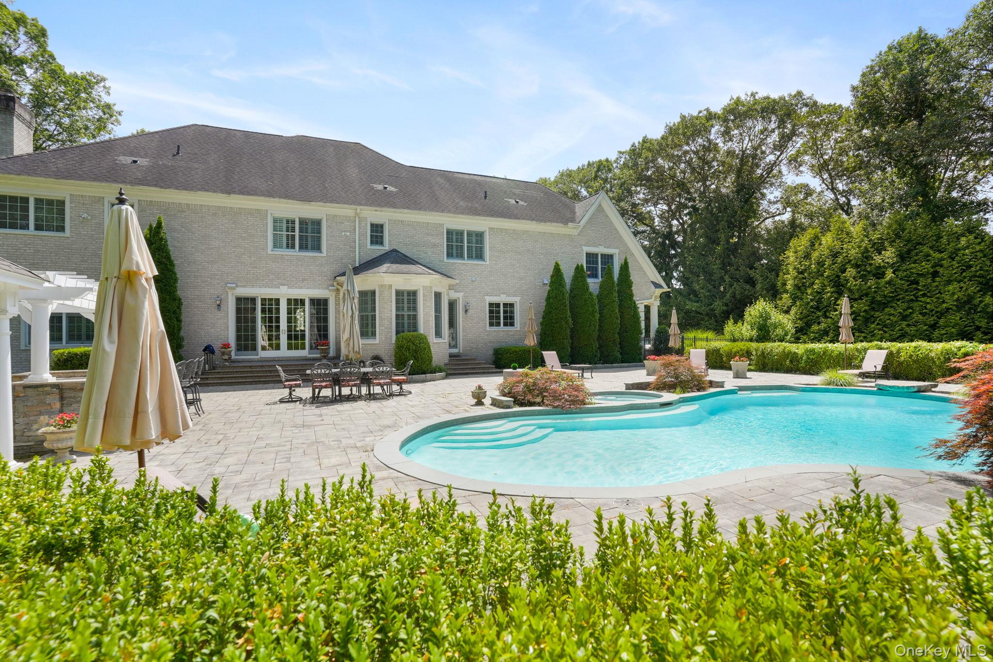 4 Hageman Court Katonah, NY 10536 - Photo 40 of 47 a view of a house with backyard and sitting area