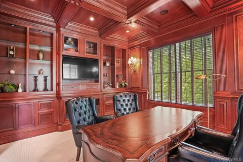 a dining room with furniture and window