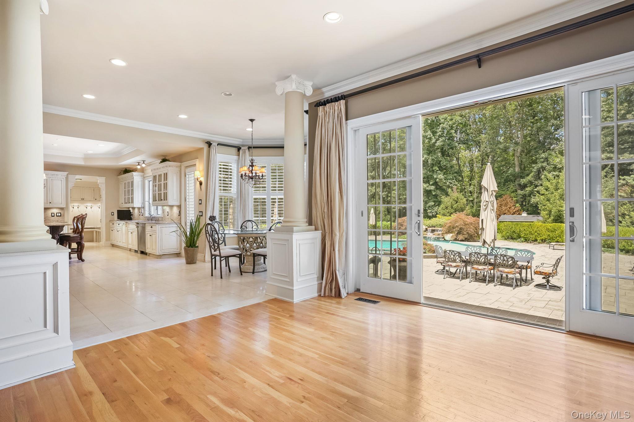 4 Hageman Court Katonah, NY 10536 - Photo 10 of 47 a view of a living room and floor to ceiling window