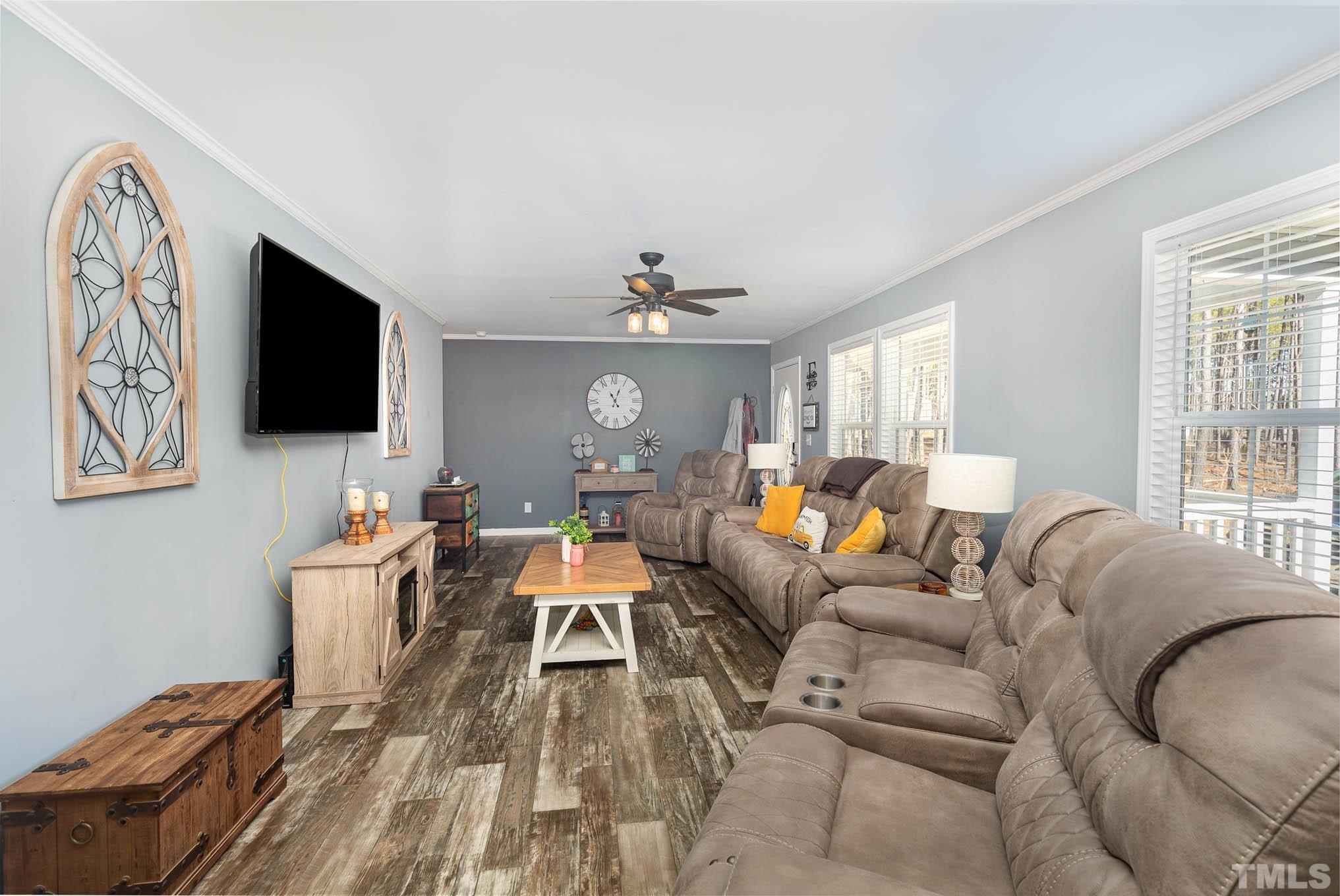 2917 Edgemont Road Wendell, NC 27591 - Photo 7 of 27 a living room with furniture and a flat screen tv