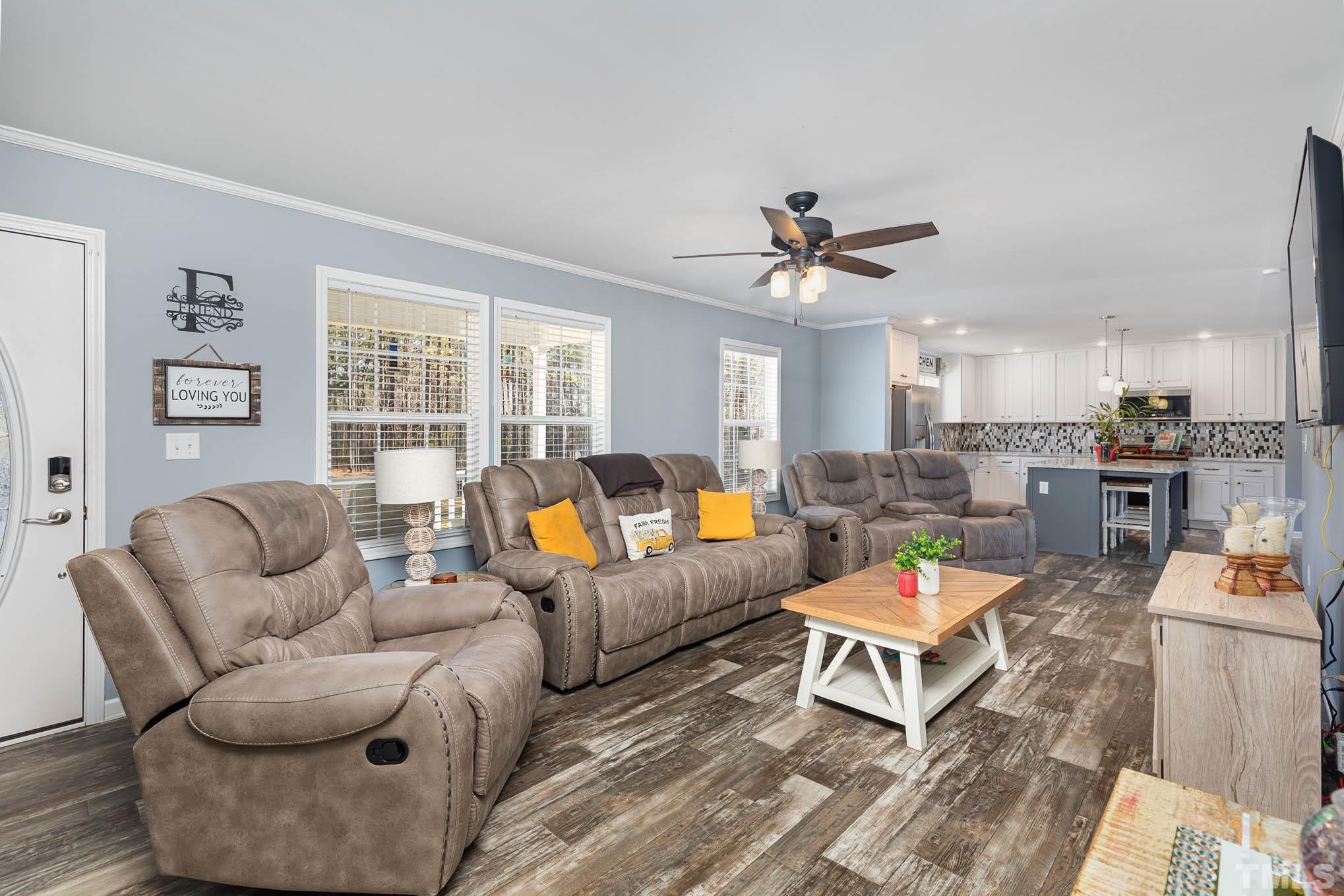 2917 Edgemont Road Wendell, NC 27591 - Photo 8 of 27 a living room with furniture kitchen view and a large window
