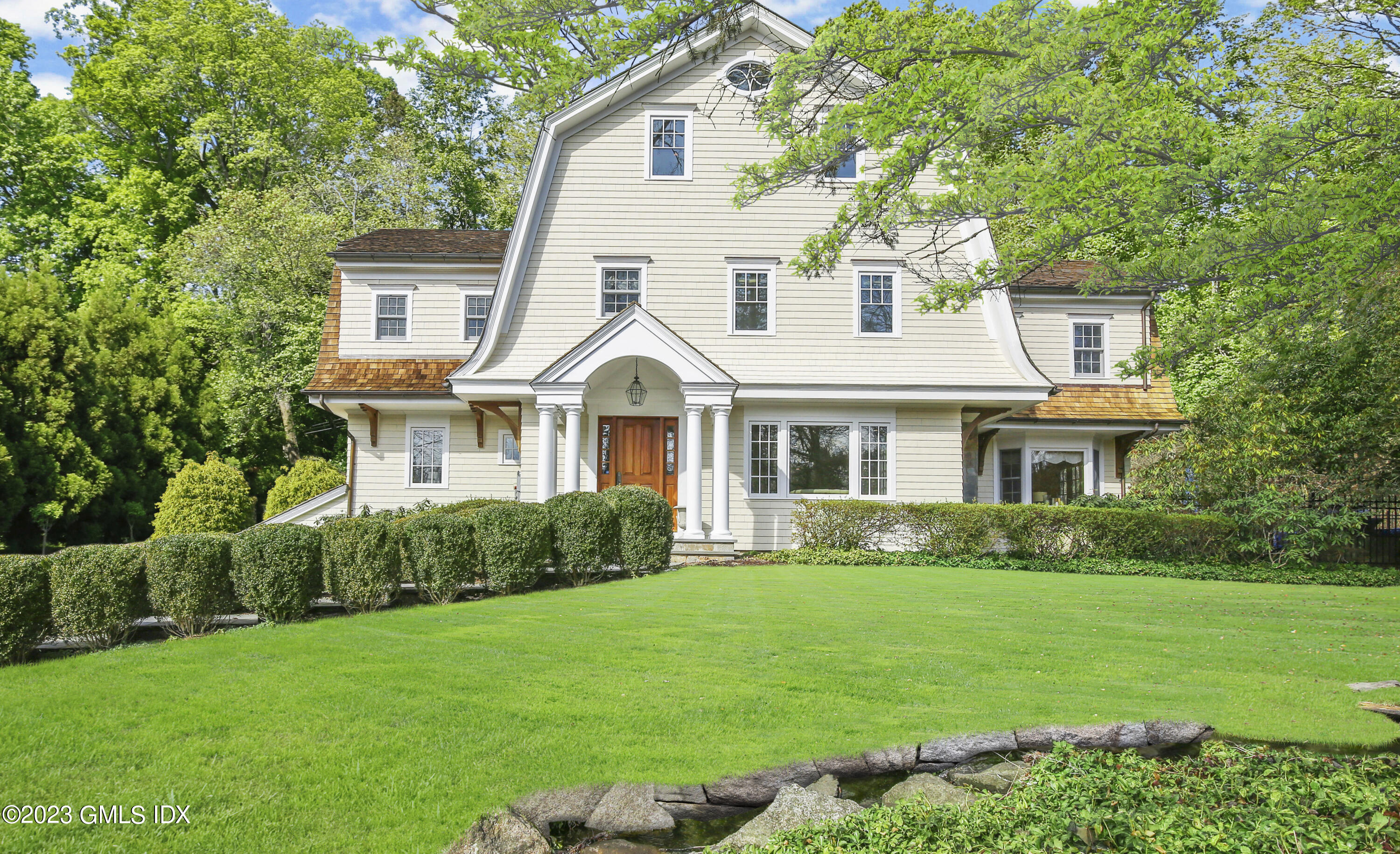 a front view of a house with a yard