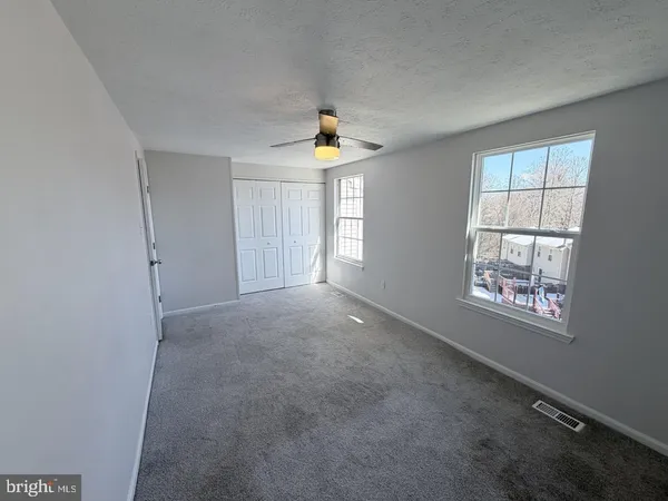 an empty room that has a window