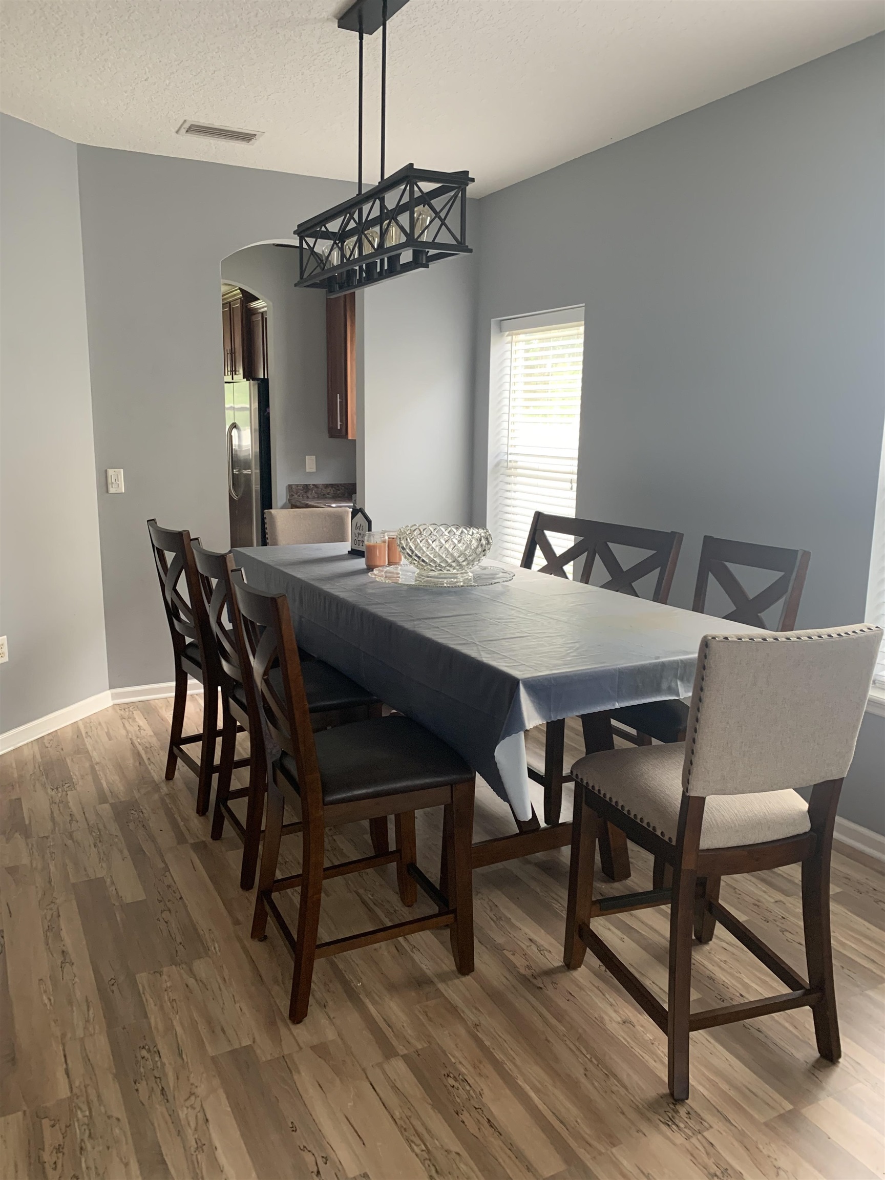 619 South Tree Garden Drive St. Augustine, FL 32086 - Photo 5 of 21 a view of a dining room with furniture window and wooden floor