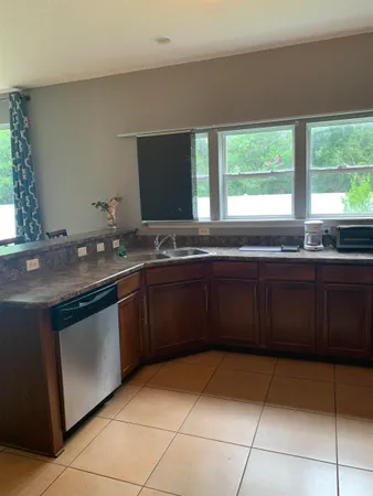a kitchen with a sink and a stove
