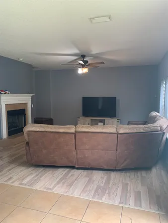 a living room with a couch and a fireplace