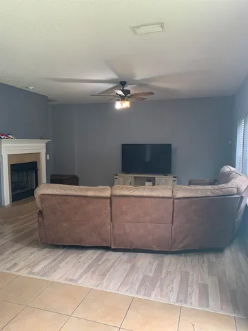 a living room with a couch and a fireplace