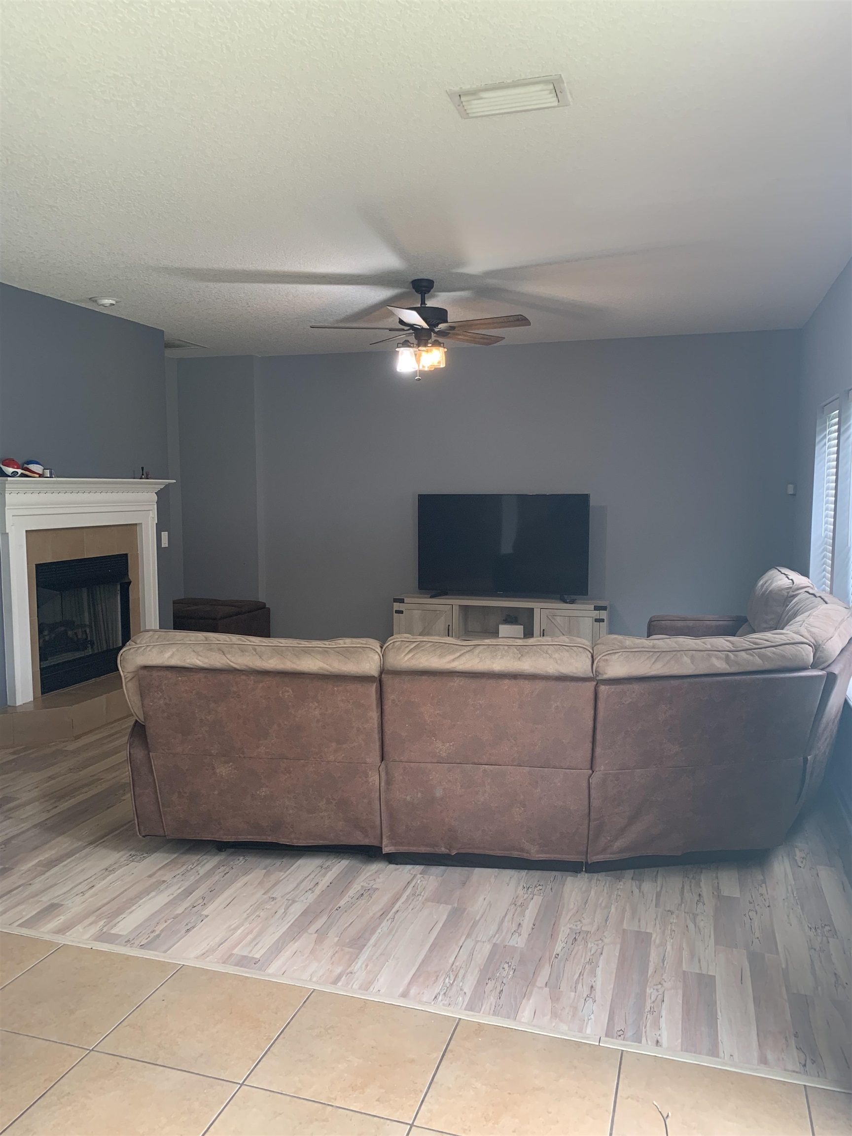 619 South Tree Garden Drive St. Augustine, FL 32086 - Photo 9 of 21 a living room with a couch and a fireplace