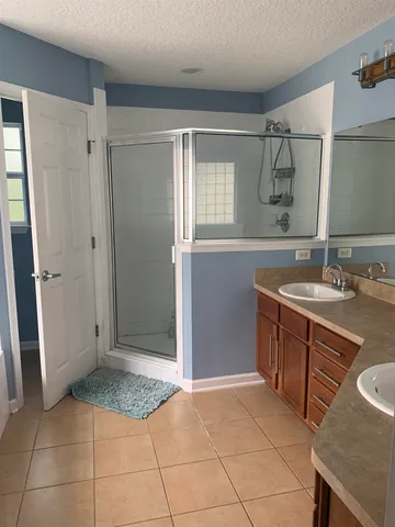 a bathroom with a sink a vanity and a mirror