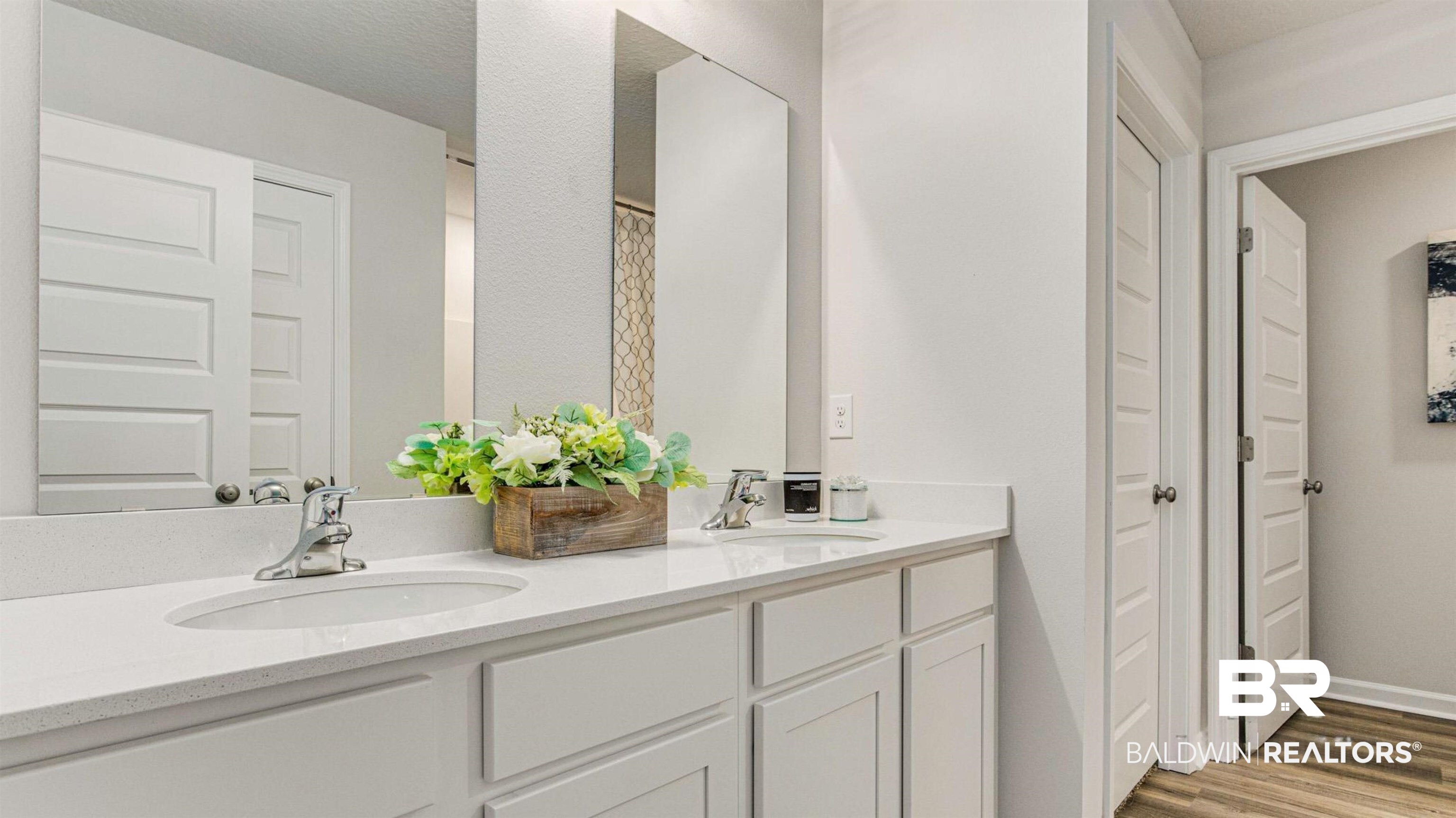 1040 Hayward Loop Foley, AL 36535 - Photo 2 of 35 Dual vanity with undermount sinks, chrome fixtures, and white cabinetry