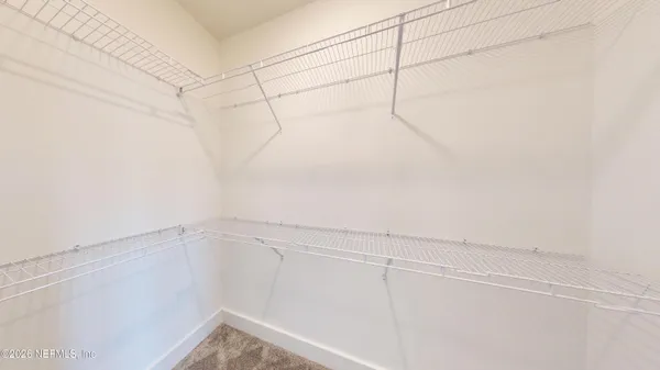 a view of a room with racks on the wall