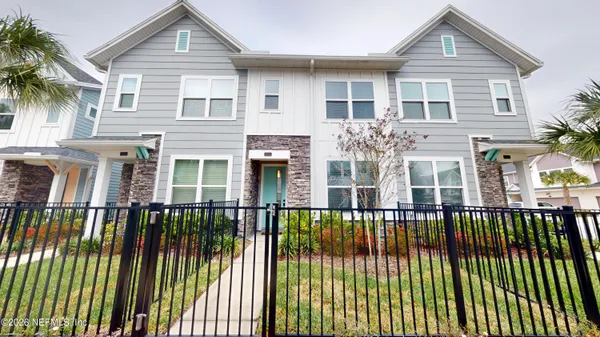 a house with palm tree in front of it
