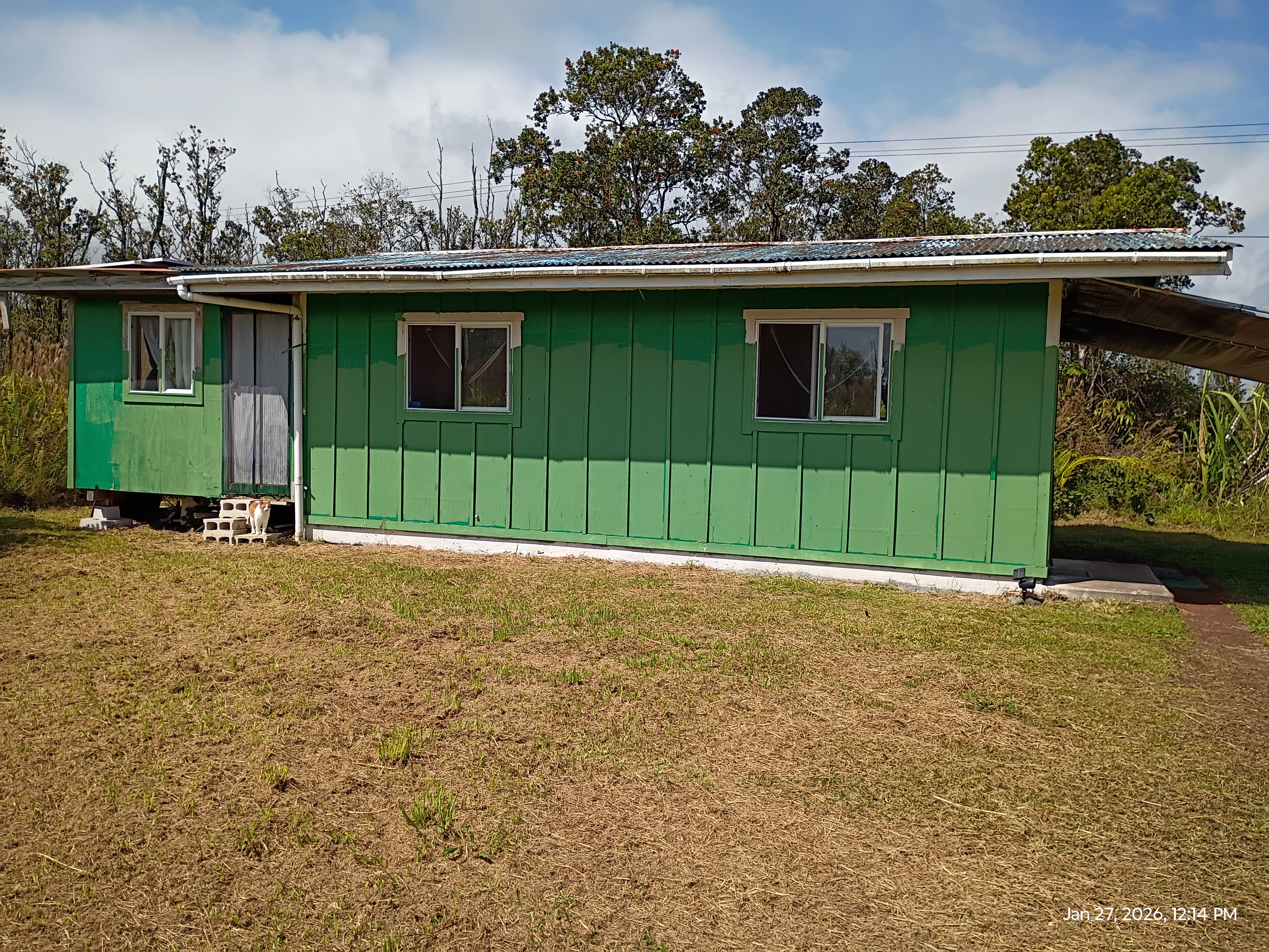 11-2311 Kaleponi Road Mountain View, HI 96771 - Photo 11 of 28 a view of a house with a yard and a garden