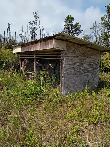 a view of a backyard of the house