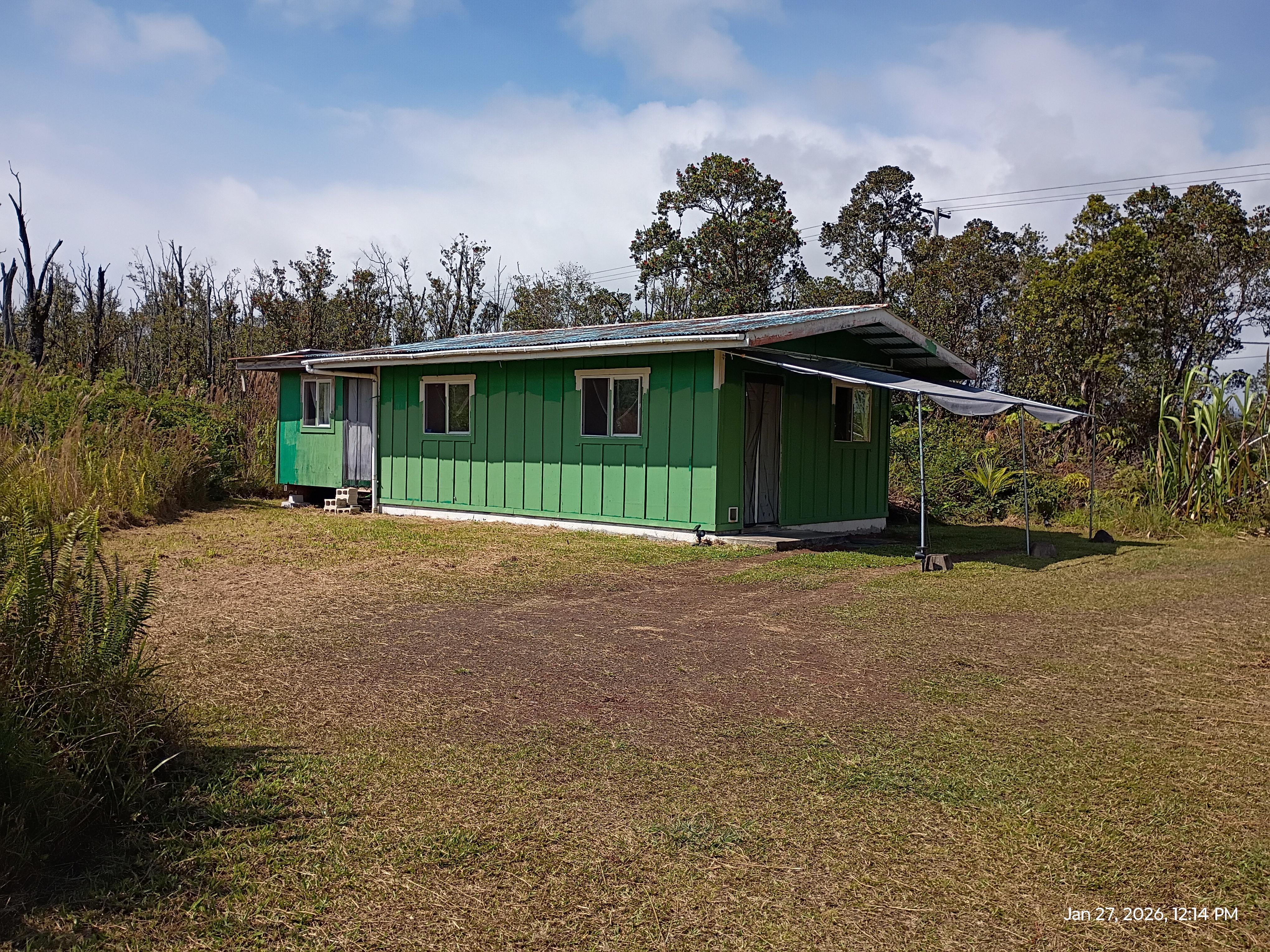 11-2311 Kaleponi Road Mountain View, HI 96771 - Photo 2 of 28 a view of a house with a backyard and trees