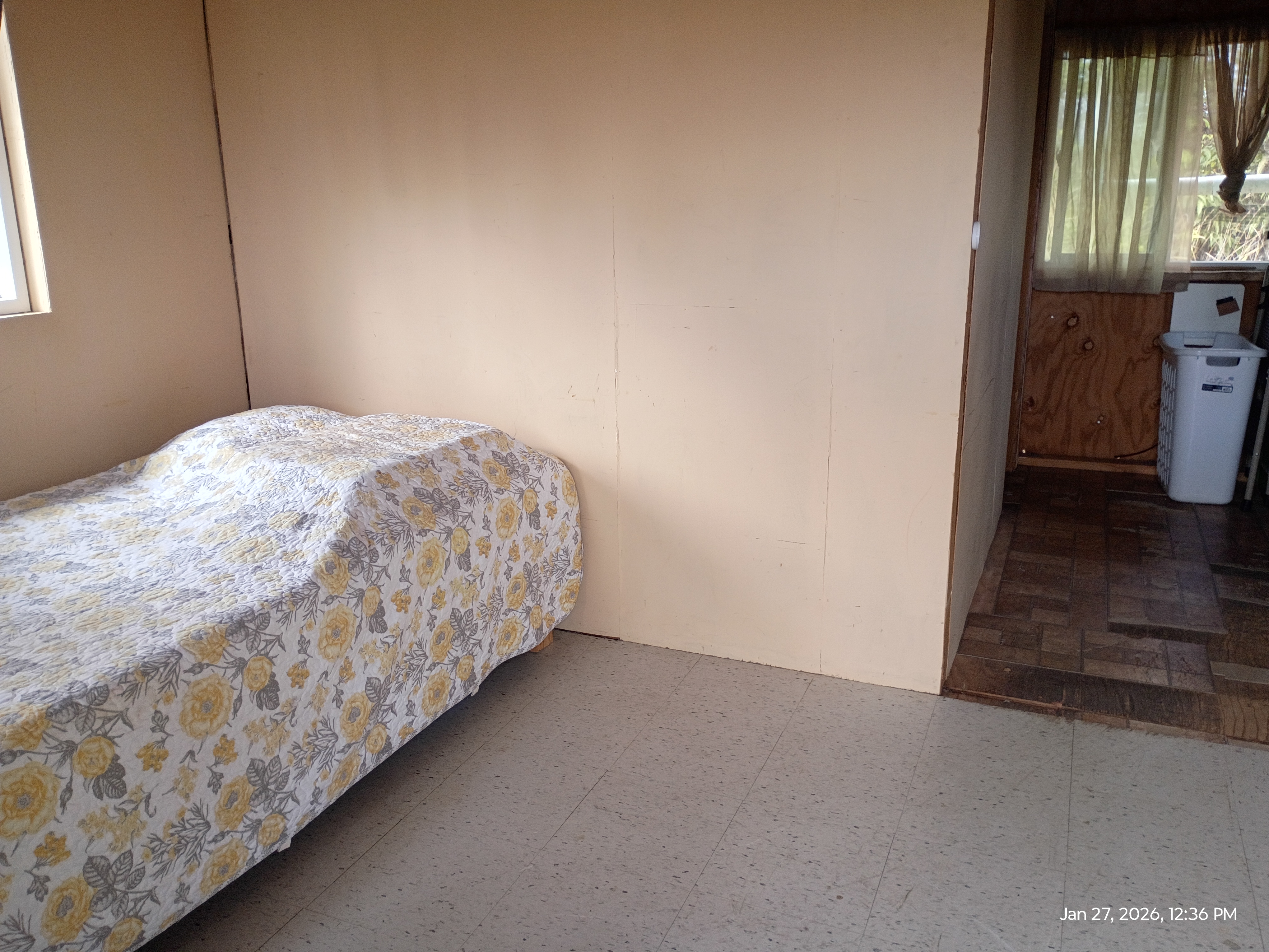 11-2311 Kaleponi Road Mountain View, HI 96771 - Photo 7 of 28 a bedroom with a bed and a painting on the wall