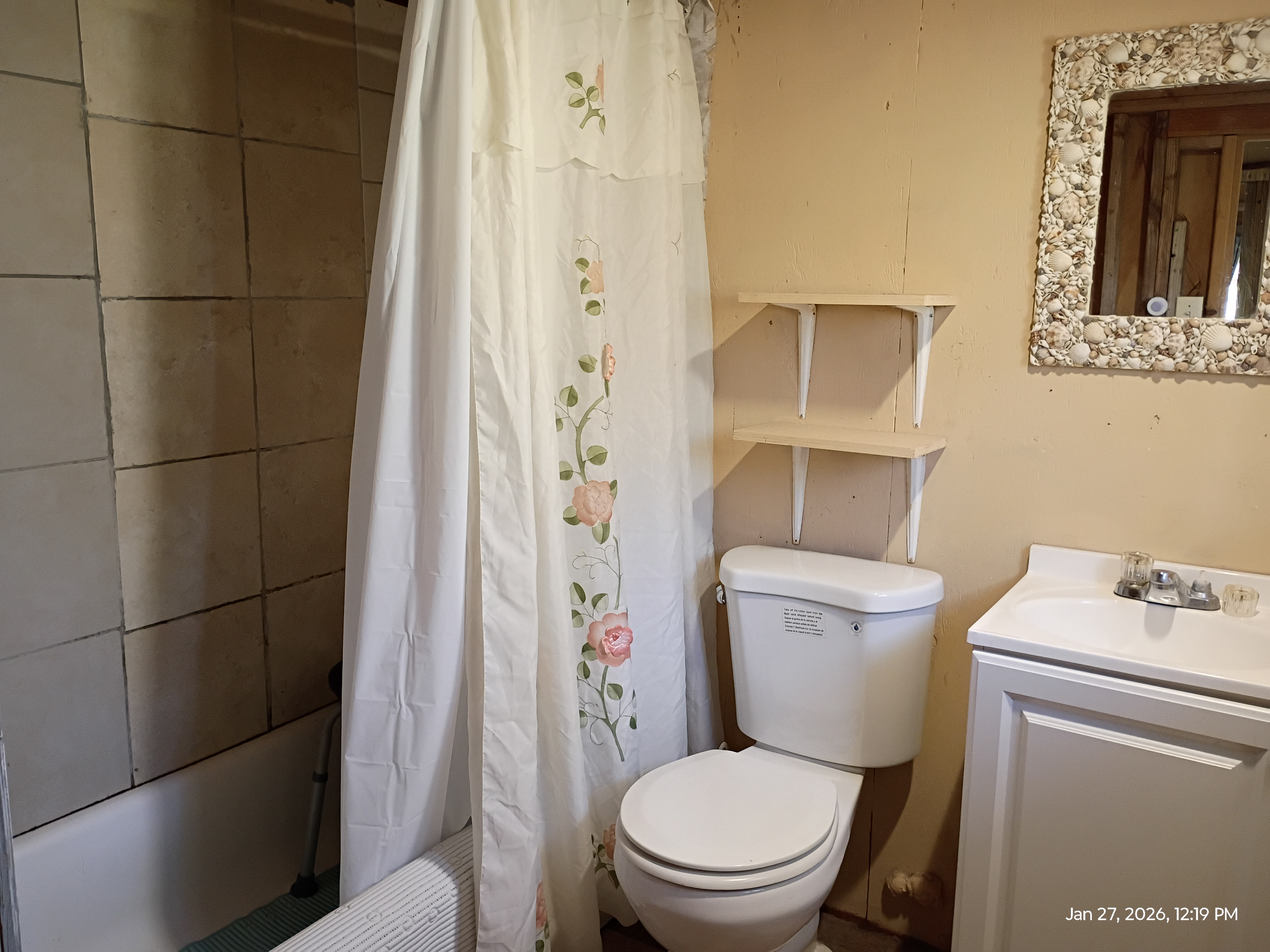 11-2311 Kaleponi Road Mountain View, HI 96771 - Photo 9 of 28 a white toilet sitting next to a bathroom sink