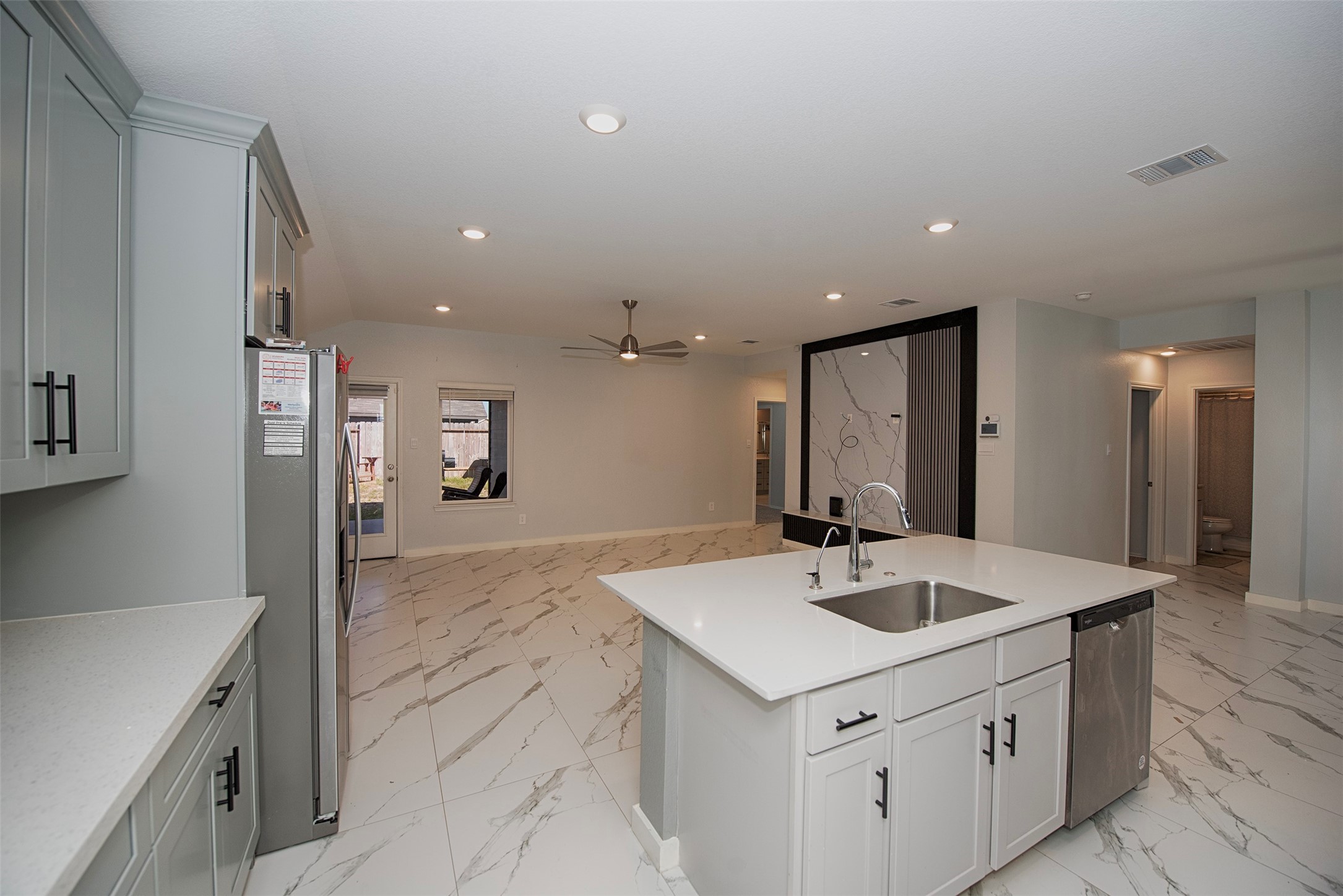 15223 Mayflower Street New Caney, TX 77357 - Photo 14 of 42 a bathroom with a sink a mirror and a shower