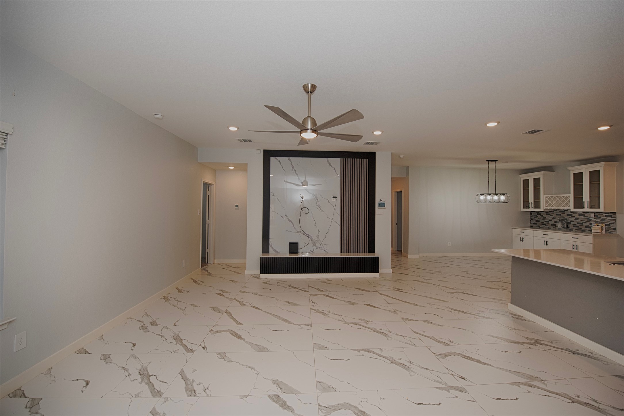 15223 Mayflower Street New Caney, TX 77357 - Photo 19 of 42 a view of an empty room with a kitchen