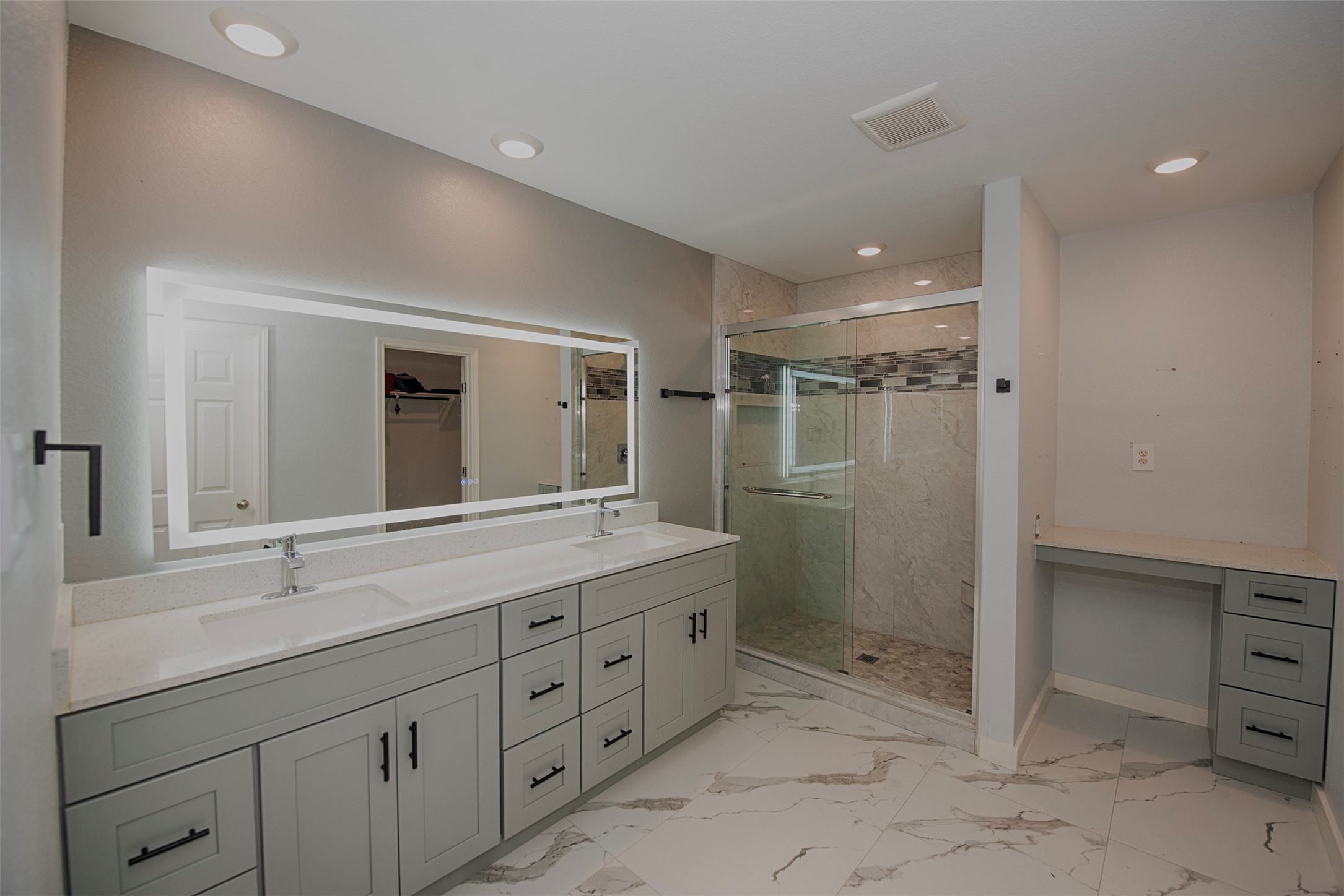 15223 Mayflower Street New Caney, TX 77357 - Photo 23 of 42 a bathroom with a shower sink and mirror