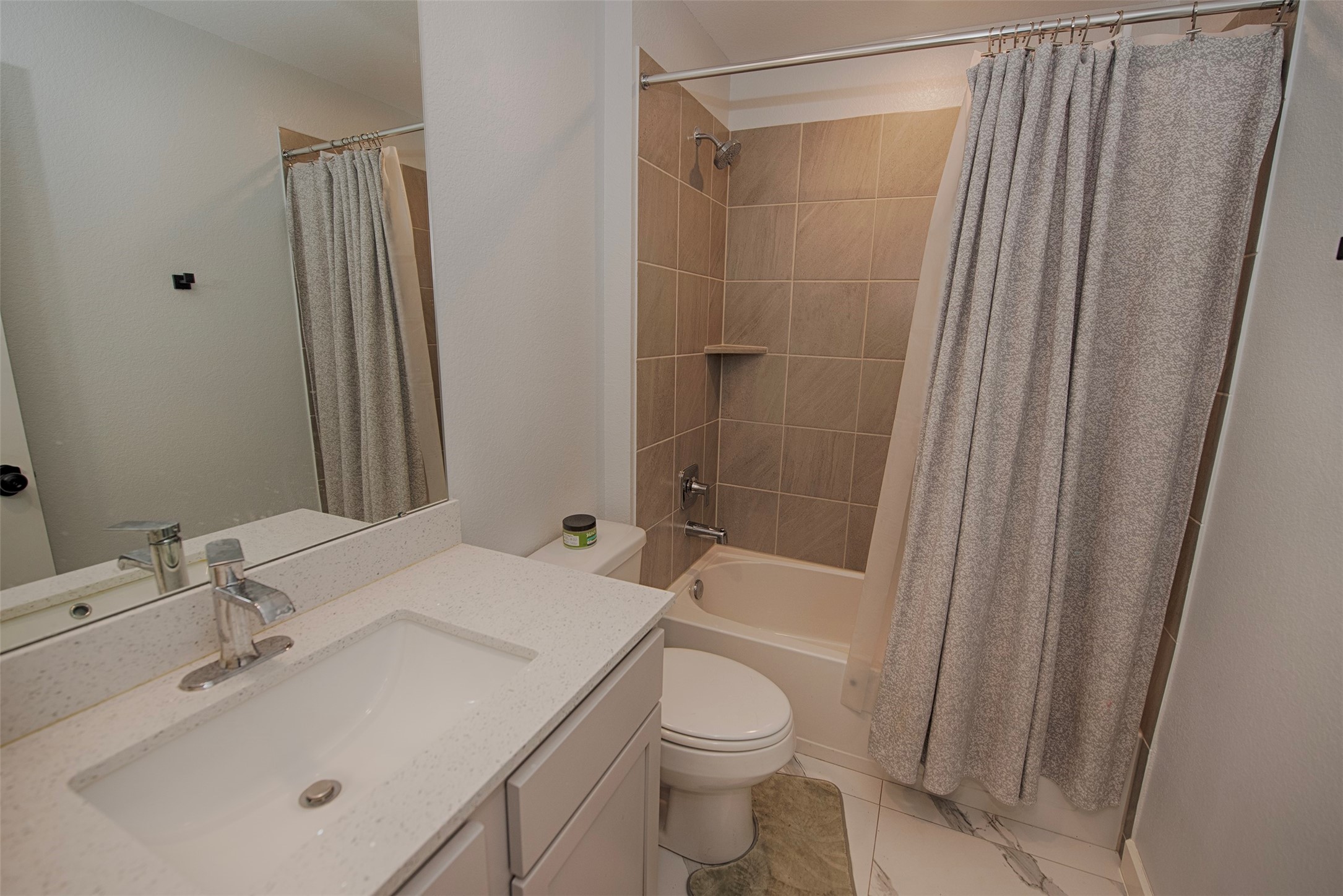 15223 Mayflower Street New Caney, TX 77357 - Photo 26 of 42 a bathroom with a sink toilet and shower