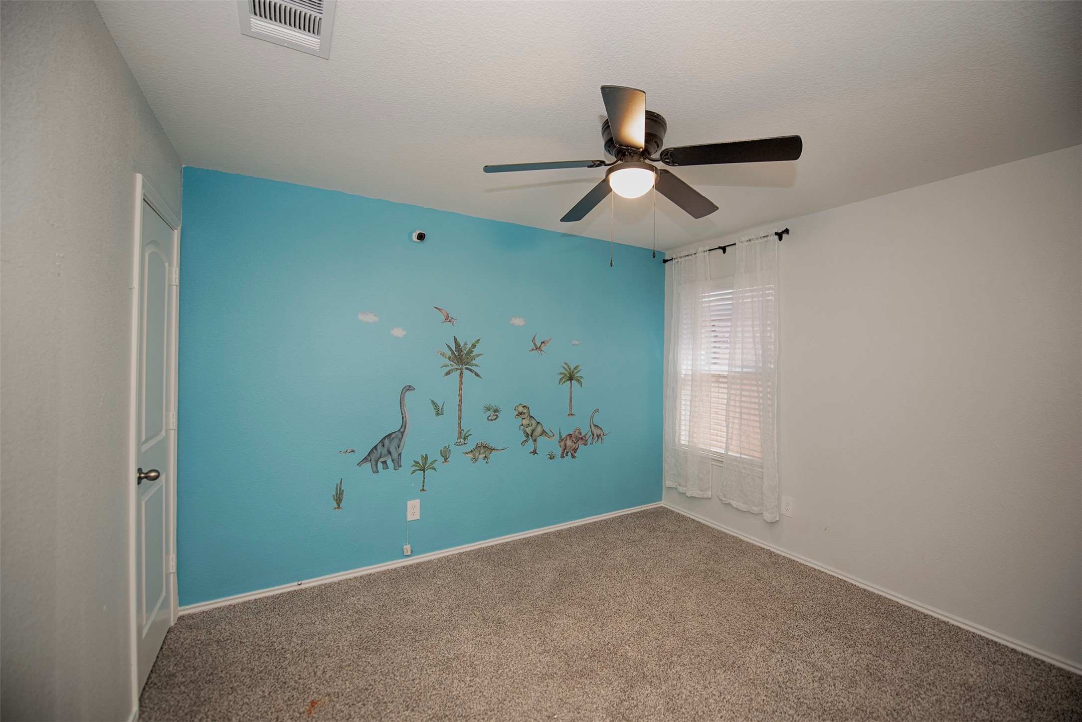 15223 Mayflower Street New Caney, TX 77357 - Photo 27 of 42 a view of a hallway with a fan