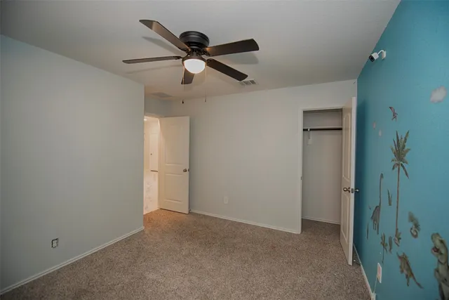 a view of a hallway with a fan