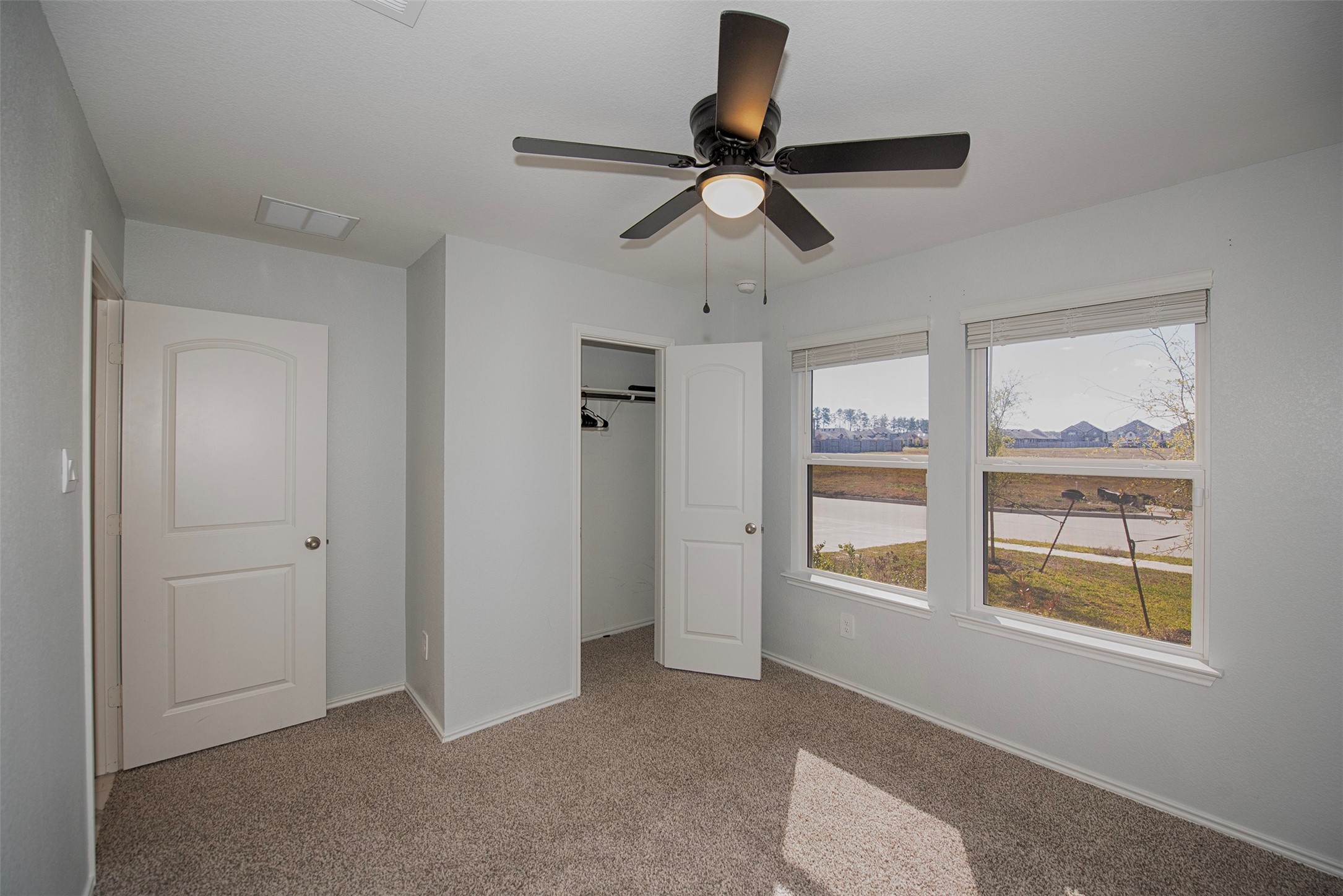 15223 Mayflower Street New Caney, TX 77357 - Photo 30 of 42 a view of an empty room and a window