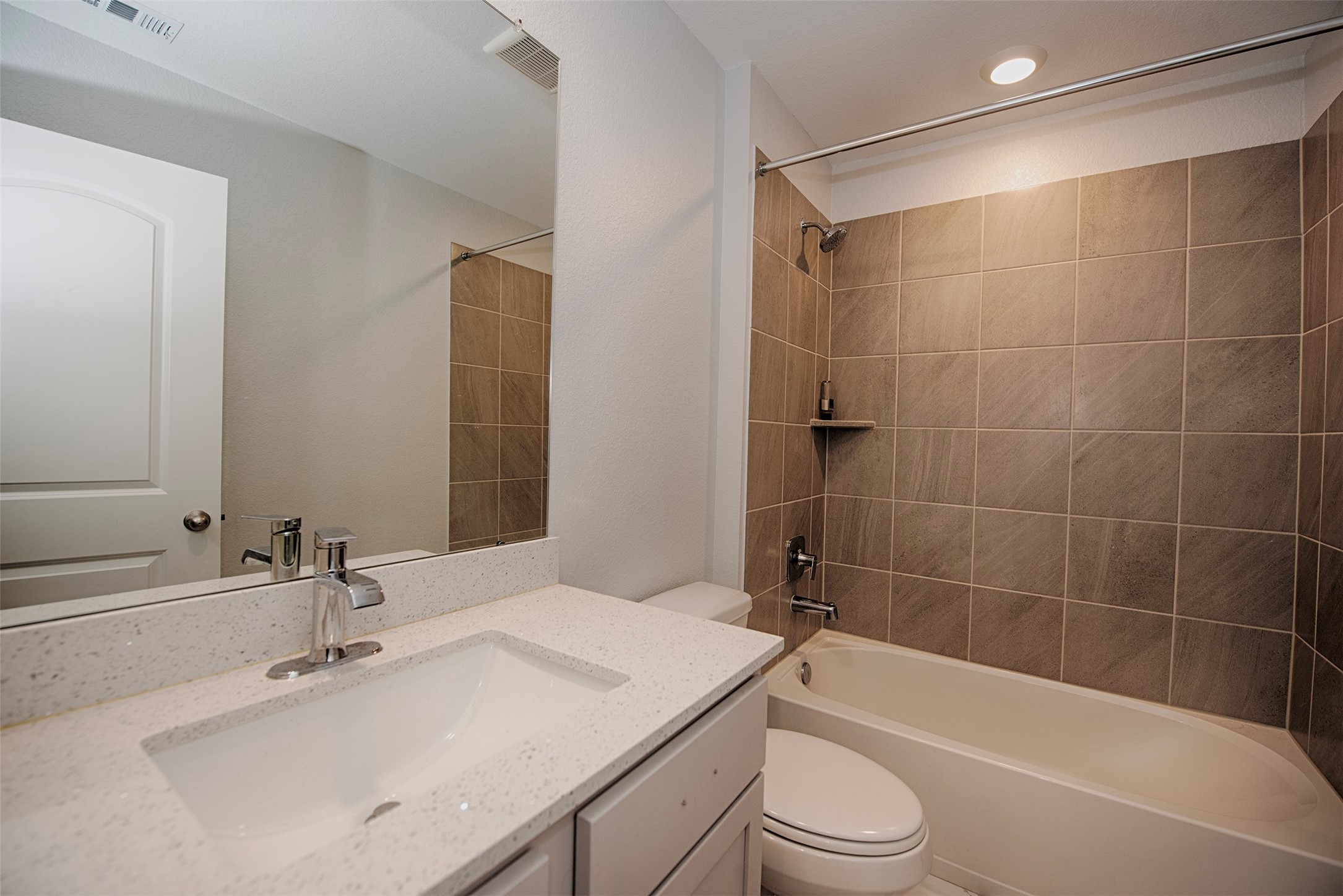 15223 Mayflower Street New Caney, TX 77357 - Photo 31 of 42 a bathroom with a sink toilet and shower