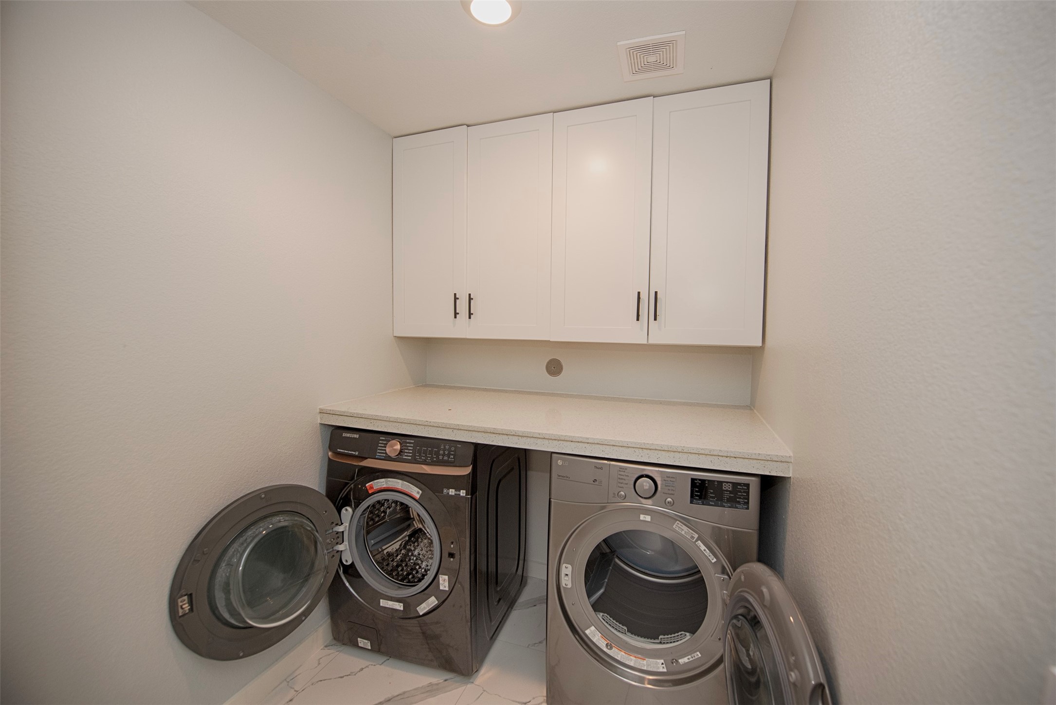 15223 Mayflower Street New Caney, TX 77357 - Photo 34 of 42 a utility room with dryer and washer