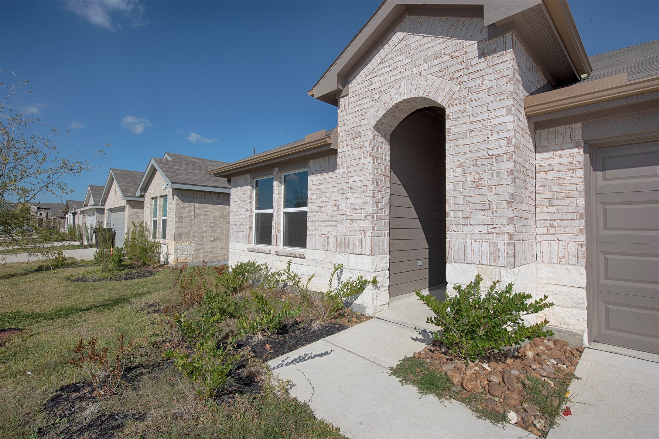 15223 Mayflower Street New Caney, TX 77357 - Photo 4 of 42 a front view of a house with garden