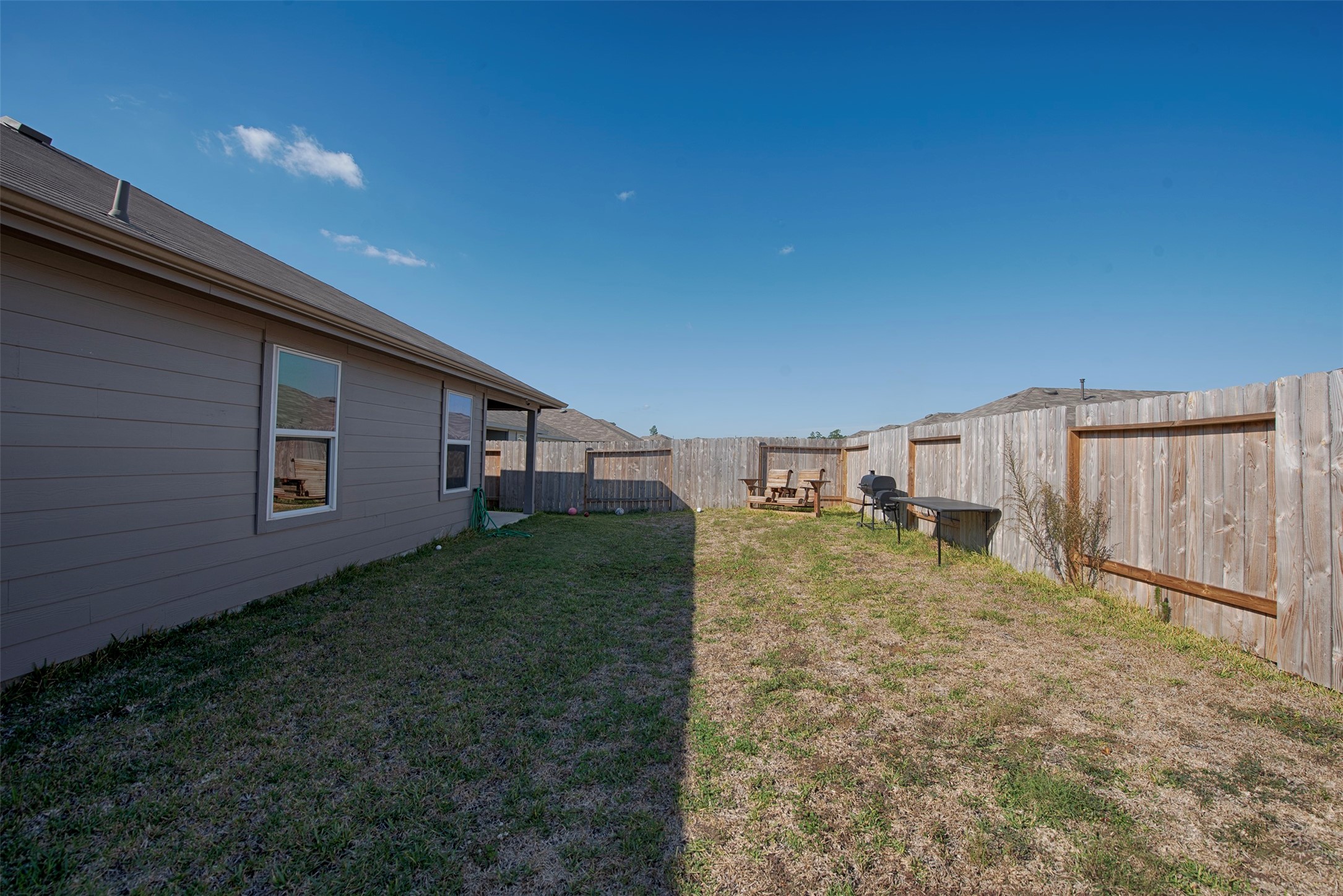 15223 Mayflower Street New Caney, TX 77357 - Photo 40 of 42 a backyard of a house