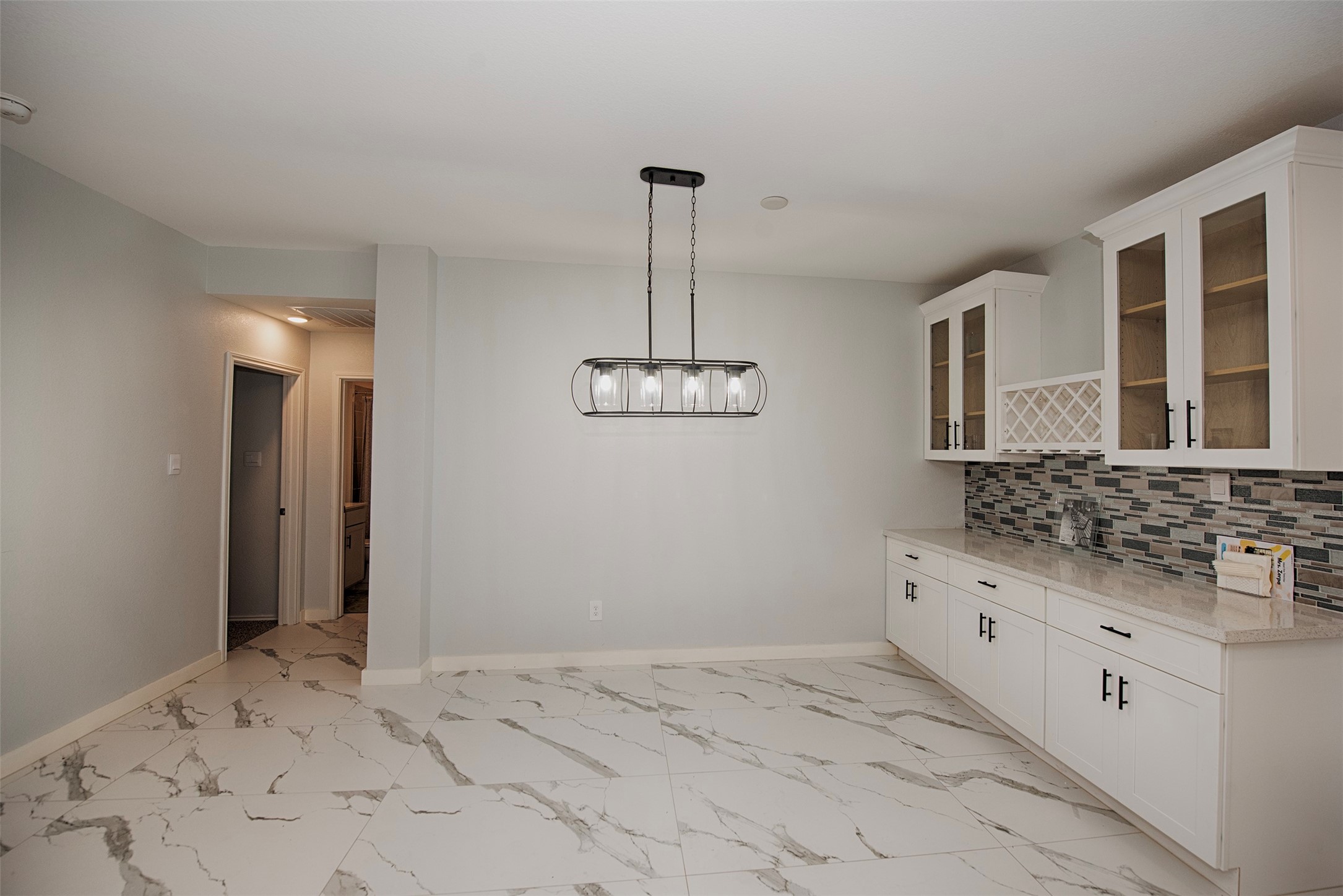 15223 Mayflower Street New Caney, TX 77357 - Photo 7 of 42 a bathroom with a granite countertop sink a mirror and shower