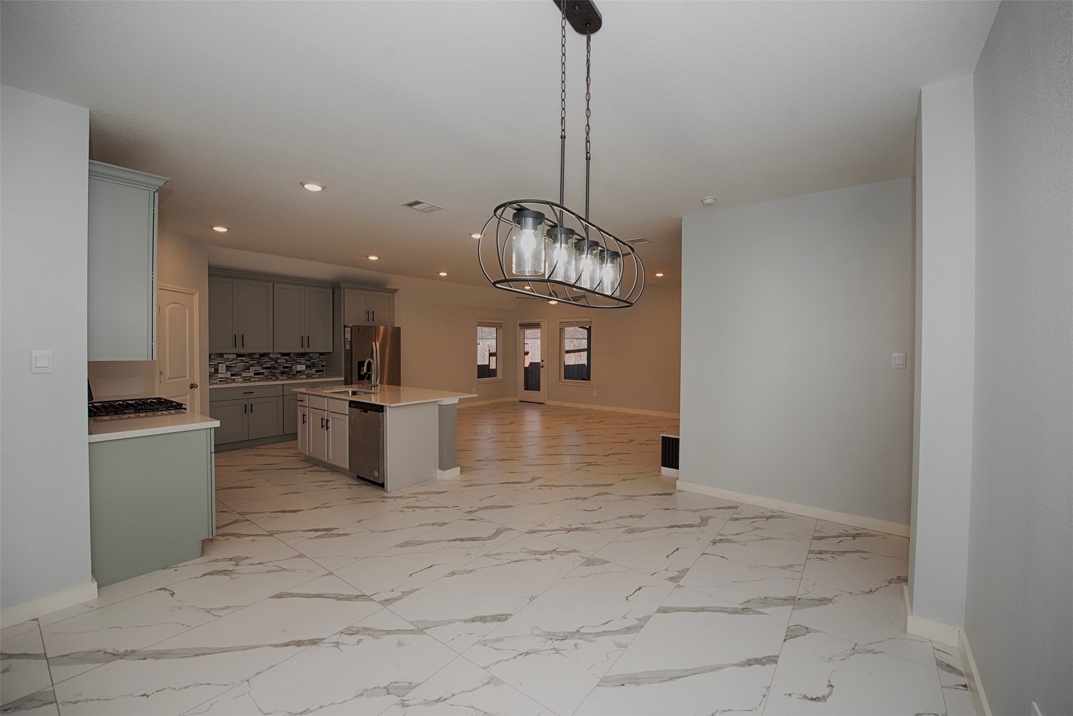 15223 Mayflower Street New Caney, TX 77357 - Photo 10 of 42 a kitchen with stainless steel appliances granite countertop a sink and cabinets