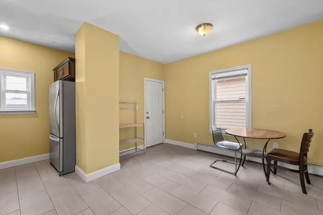 a view of a livingroom with furniture and a window