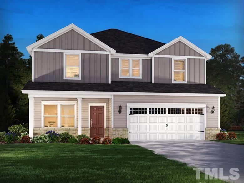 3913 Mountjoy Trail Raleigh, NC 27616 - Photo 1 of 5 a front view of a house with a yard