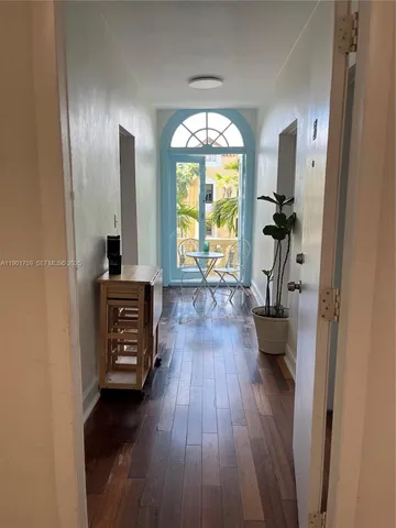 a view of living room with furniture and a window