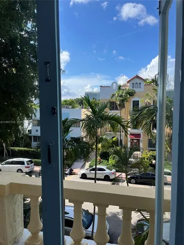 a view of a street with cars