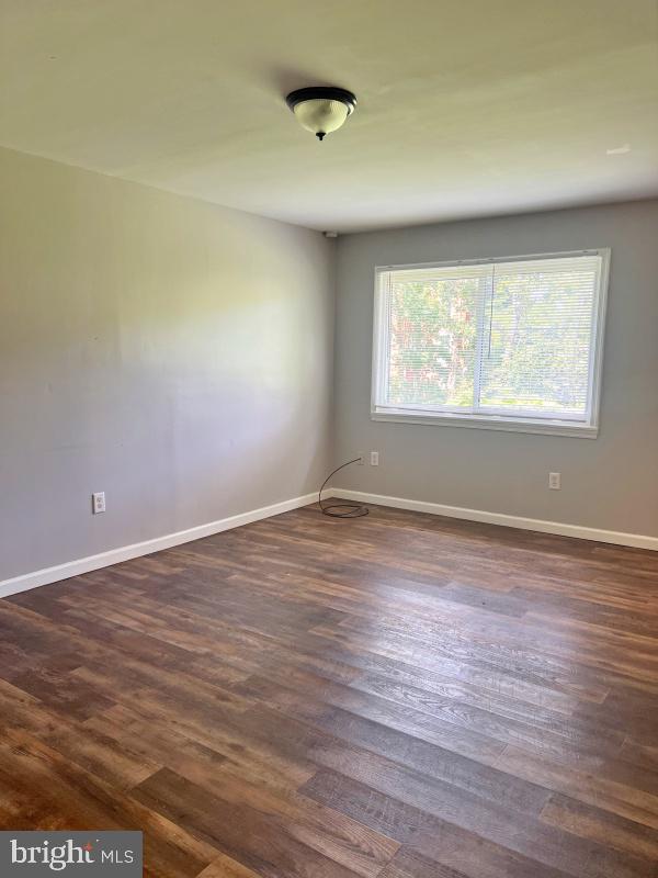 27 East Main Street, Unit D Windsor, PA 17366 - Photo 2 of 7 an empty room with wooden floor and windows
