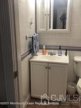 80 Greenwood Loop Road, Unit 80 Brick, NJ 08724 - Photo 16 of 38 a bathroom with a sink and a vanity