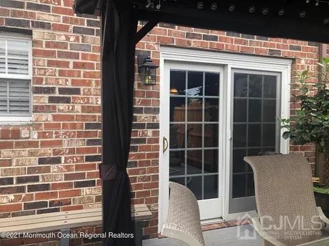 80 Greenwood Loop Road, Unit 80 Brick, NJ 08724 - Photo 22 of 38 a view of a door and chair