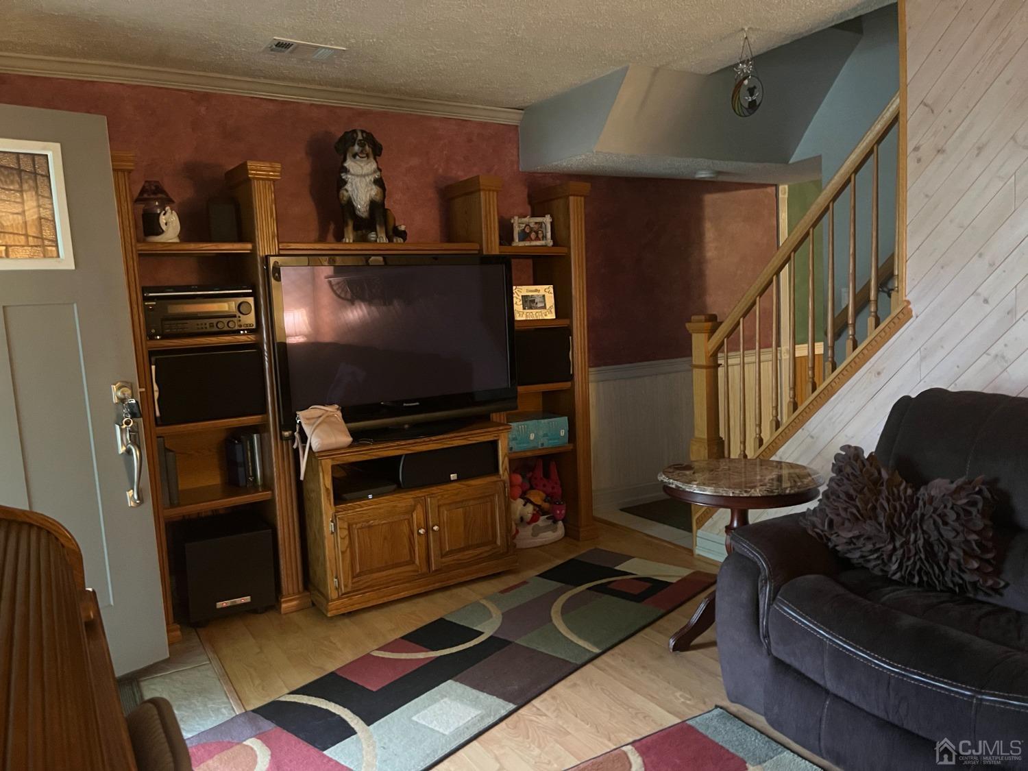 80 Greenwood Loop Road, Unit 80 Brick, NJ 08724 - Photo 3 of 38 a living room with furniture and a flat screen tv