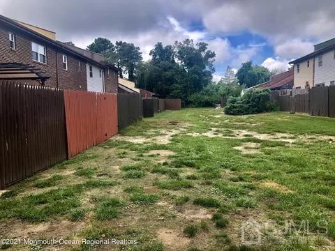 80 Greenwood Loop Road, Unit 80 Brick, NJ 08724 - Photo 37 of 38 a backyard of a house with lots of green space