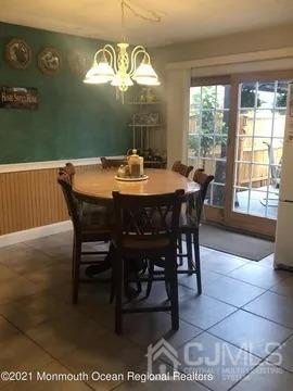 80 Greenwood Loop Road, Unit 80 Brick, NJ 08724 - Photo 6 of 38 a view of a dining room with furniture and window