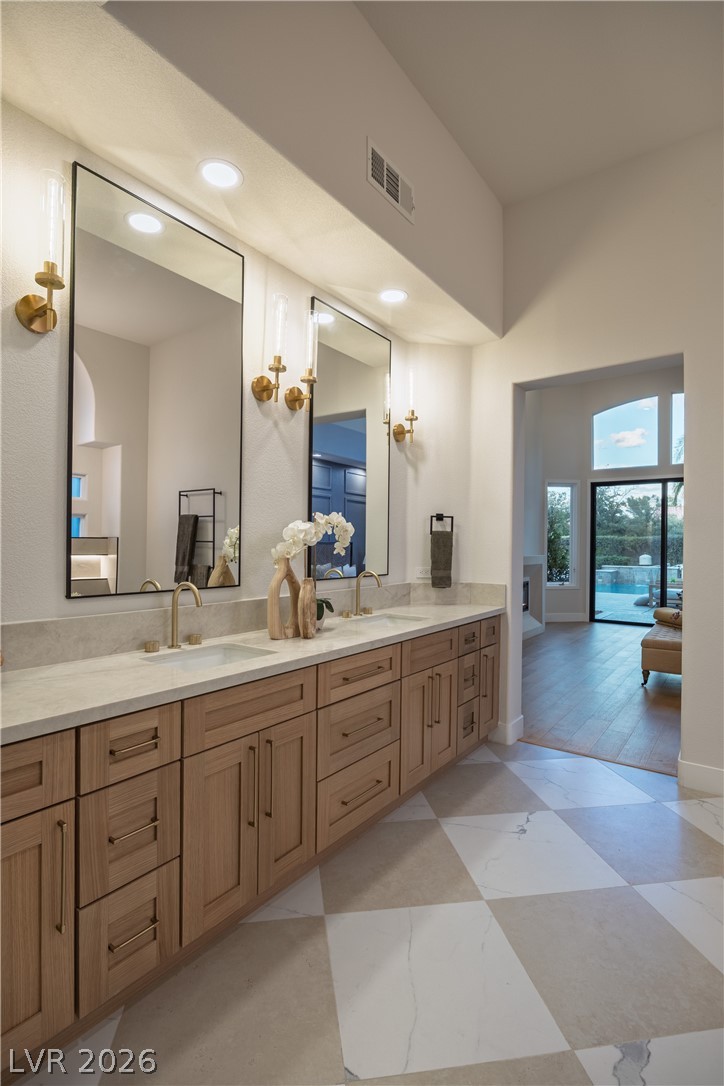 8800 Lusso Las Vegas, NV 89134 - Photo 49 of 85 Full bathroom featuring double vanity, recessed lighting, and a high ceiling
