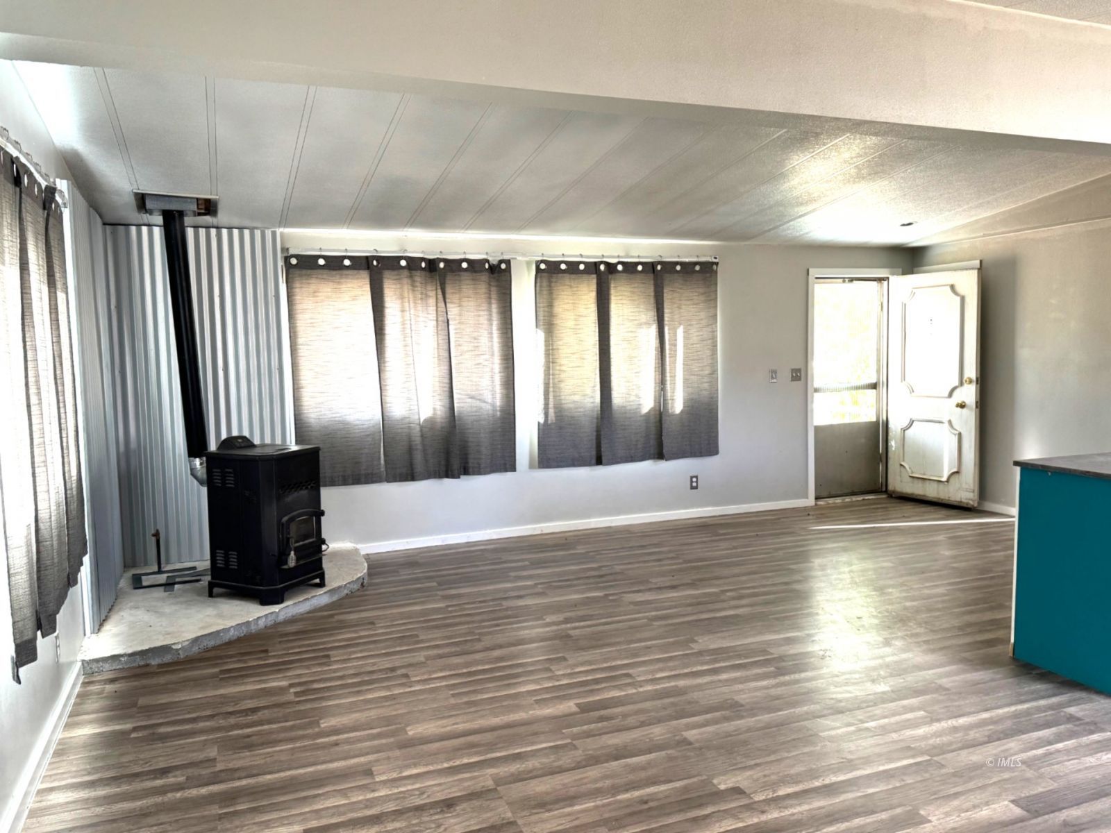464 Bartell Road, Unit 1 Big Pine, CA 93513 - Photo 2 of 10 Living Room with Wood Stove