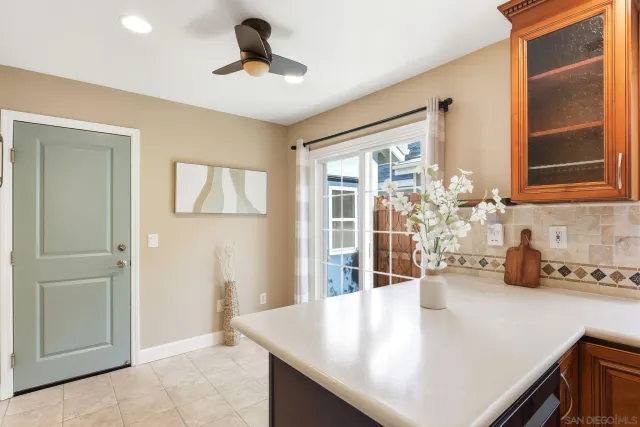 a kitchen with a sink a counter and cabinets