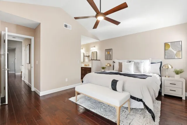 a view of living room with furniture and wooden floor