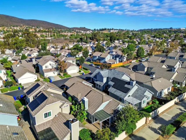 an aerial view of residential houses with outdoor space